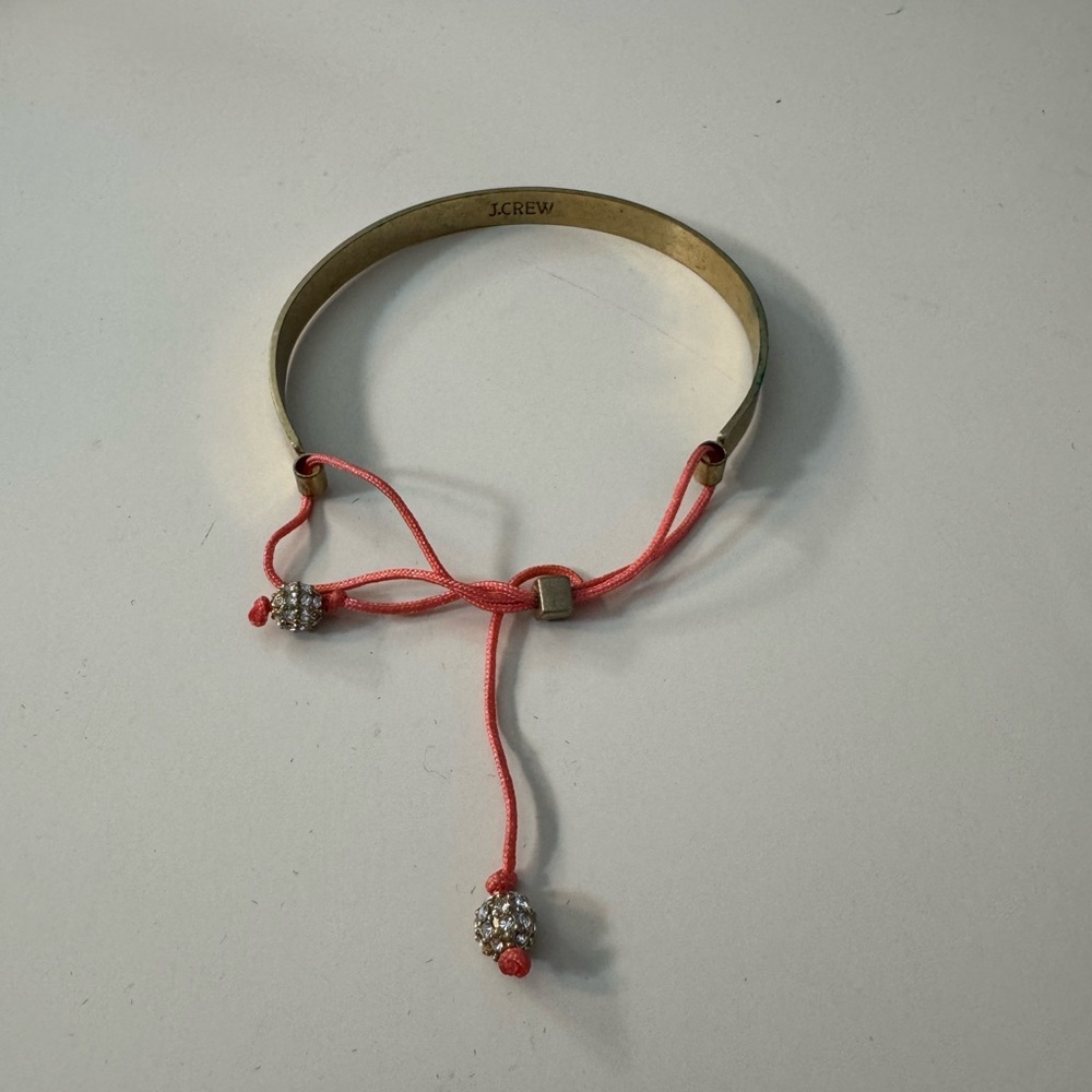 J. Crew Gold Bangle with Pink Cord